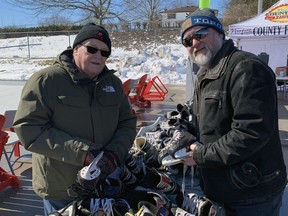Mike Bollert, left, a past president of the Norfolk County Agricultural Society, and current president Brad Nunn with some of the skates available to those attending a free community pop-up skating party at the Simcoe fairgrounds on Saturday. The event is one of many the agricultural society is holding this year as part of an overall plan to make better use of its facilities throughout the year.