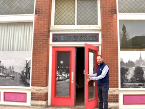 St. Marys CAO Brent Kittmer holds open the door to the former Mercury Theater at 14 Church St. N. where, for the first time in almost two decades, town residents will have the opportunity to look inside during an open house April 1 held as part of the town's downtown service location review.  Galen Simmons/The Beacon Herald/Postmedia Network