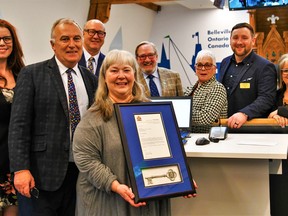 Belleville Mayor Neil Ellis and city council presented Monday Susan Walsh, special events planner with the Chamber of Commerce, with a framed certificate and Key to the City, to recognize her decades of critical services to the community. Walsh retires Friday.