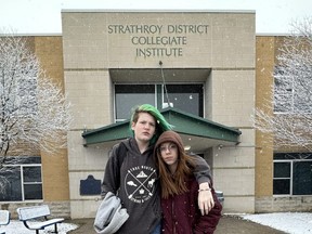 Grade 9 students Woodland Mavka and Aleks Godfrey-Fidom are among the more than 200 students who have signed an online petition after their high school, Strathroy District Collegiate Institute, decided to remove external washroom doors at the school. (JONATHAN JUHA/The London Free Press)