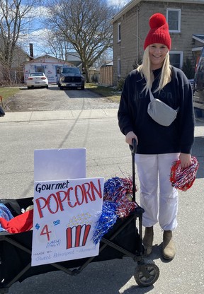 Hayley Mattice of the Hagersville Skating Club was selling gourmet popcorn to people standing in line to purchase tickets at the Hagersville Legion for the Catch the Ace charity fundraising draw.  The jackpot was more than $1.75 million in the March 30 draw.  SIMCOE REFORM