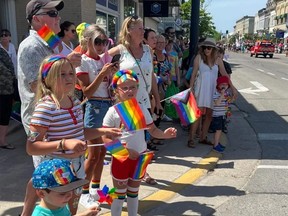 Spectators lined the street in downtown Kincardine to watch the Pride Parade in 2022. The 2023 parade is being rerouted due to construction on Queen Street. Kincardine News photo.