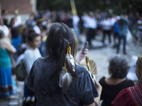 Sixties Scoop survivors and supporters gather for a demonstration at a courthouse on the day of a class-action court hearing in Toronto on Tuesday, August 23, 2016. (THE CANADIAN PRESS/Michelle Siu)
