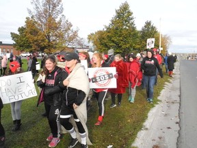 Glengarry District High School students march on the grounds of their school during a walkout rally in support of keeping their school open on Tuesday October 25, 2016 in Cornwall, Ont. Greg Peerenboom/Cornwall Standard-Freeholder/Postmedia Network