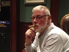 Leo Robert enjoys a cigar. Image supplied by Blake Robert