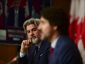 FILE PHOTO: Leader of the Government in the House of Commons Pablo Rodriguez (now Canada's Heritage Minister) looks towards Prime Minister Justin Trudeau as they take part in a press conference during the COVID pandemic in Ottawa on Friday, Oct. 16, 2020.