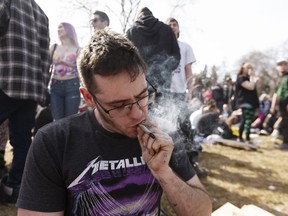 A man celebrates during the 4/20 marijuana rally at the Alberta Legislature in Edmonton on Friday, April 20, 2018. Photo by Ian Kucerak/Postmedia Network