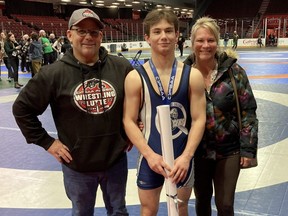 Ursuline Lancers' Braydon Segeren celebrates with his parents, Don and Steph, after winning gold at the OFSAA wrestling championship in Ottawa on March 8, 2023. (Contributed Photo)