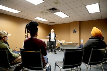 Scott Florence, executive director for the Sudbury Workers Education and Advocacy Centre, leads a discussion to mark the International Day for the Elimination of Racial Discrimination at the Greater Sudbury Public Library's MacKenzie Street branch in Sudbury, Ontario on Saturday, March 18, 2023. Migrants and supporters held rallies and other events in Sudbury, Edmonton, Montreal, Toronto, Vancouver and Niagara Falls on Saturday and Sunday to call on Prime Minister Justin Trudeau to ensure permanent resident status for all migrants and refugees, including undocumented people, as he promised in December 2021. According to the Migrant Rights Network, more than 1.7 million migrants grow food, take care of children, the sick and the elderly, and are essential to Canadian communities, but are denied rights available to everyone else because they don’t have permanent resident status. For more information, visit www.migrantrights.ca. Ben Leeson/The Sudbury Star/Postmedia Network