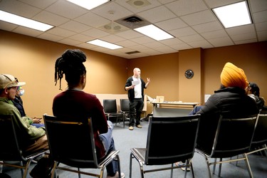 Scott Florence, executive director for the Sudbury Workers Education and Advocacy Centre, leads a discussion to mark the International Day for the Elimination of Racial Discrimination at the Greater Sudbury Public Library's MacKenzie Street branch in Sudbury, Ontario on Saturday, March 18, 2023. Migrants and supporters held rallies and other events in Sudbury, Edmonton, Montreal, Toronto, Vancouver and Niagara Falls on Saturday and Sunday to call on Prime Minister Justin Trudeau to ensure permanent resident status for all migrants and refugees, including undocumented people, as he promised in December 2021. According to the Migrant Rights Network, more than 1.7 million migrants grow food, take care of children, the sick and the elderly, and are essential to Canadian communities, but are denied rights available to everyone else because they don’t have permanent resident status. For more information, visit www.migrantrights.ca. Ben Leeson/The Sudbury Star/Postmedia Network