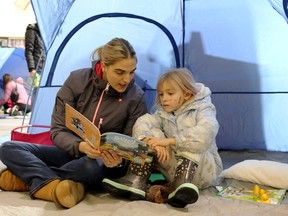 A mother and child reading during Family Literacy Day. 2022 was a busy year at the library.