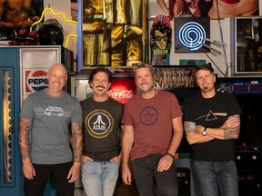 Nickelback L-R: Mike Kroeger (bassist), Ryan Peake (guitarist), Chad Kroeger (vocalist/ guitarist), Daniel Adair (drummer).