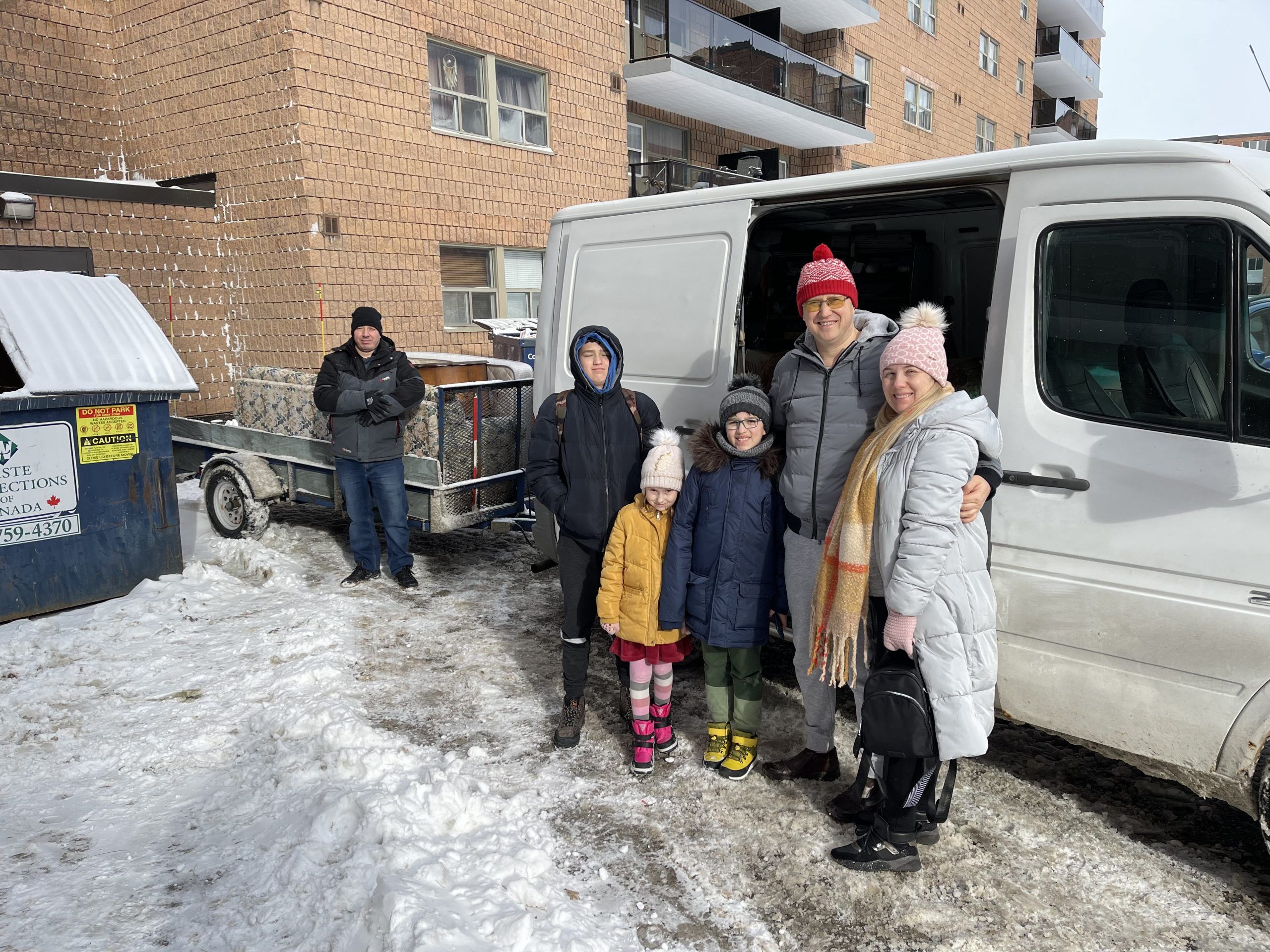 Ivan and Katarina Ianiuk, right, recently settled into a Brantford apartment with the assistance of Pastor Oleg Stepus (left) and the Full Gospel Slavic Church. Katerina recently gave birth to a baby boy.