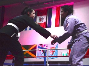Airdrie athlete Justine Olisov (right) won her Brazilian Jiu Jitsu match during the United Strong Women's Muay Thai Gala on March 11.