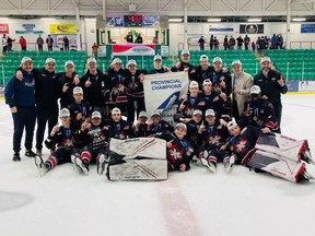 The Airdrie Xtreme U15 hockey team take a celebratory team photo on the ice after taking home the AEHL Provincial Championship on March 26.