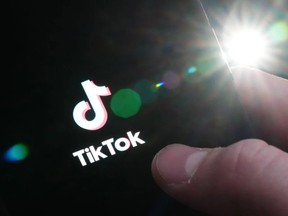 The TikTok startup page is displayed on an iPhone in Ottawa on Monday, Feb. 27, 2023. PHOTO BY SEAN KILPATRICK /The Canadian Press