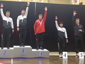 Quinte Bay Gymnastics Tumblers Justin Thompson (Gold), Jared Matthews (Silver) and Philo Malek (Fourth) competed in the Senior Men's Division at the Elite Canada competition held recently in Longueuil, Que. SUBMITTED PHOTO