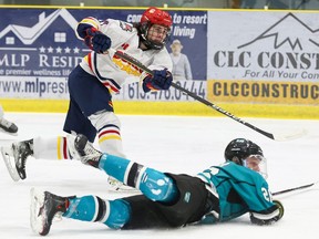 Wellington Dukes Matheson Mason (#17) shoots the puck past a sprawling Lindsay Muskies Gavin Keller during the Dukes 6-1 win Friday at the Wellington and District Community Centre. ED McPHERSON/OJHL IMAGES