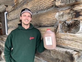 Dan Howell of Brantview Farms holds a sample of the farm's award-winning sweet apple cider. The cider was named champion at the Ontario Fruit and Vegetable Convention in Niagara Falls on Feb. 22.