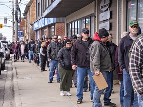 Long lines of people snake throughout downtown Hagersville, Ontario on Thursday March 16, 2023 as a Catch the Ace draw enters its 43rd week with a jackpot of more than $1.2 million.