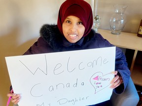 Nasro Mohamed recently joined Brockville supporters to draw up 'Welcome' signs for her husband and young daughter, who are scheduled to arrive in Ottawa on Wednesday. (SUBMITTED PHOTO)