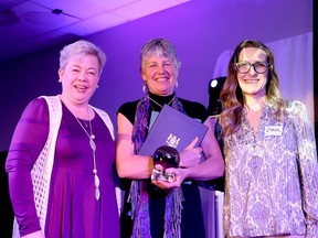 Jeanette Johnston, left, business development officer at the Leeds Grenville Small Business Centre, poses with Lifetime Achievement Award winner Wendy Banks, along with Carol Hardy, a small business programs assistant at the centre, at the Memorial Centre on International Women's Day on Wednesday. (RONALD ZAJAC/The Recorder and Times)