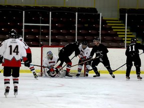 Participants in the Brockville Magedoma Old Timers Tournament battle it out in front of the net on Wednesday afternoon. (RONALD ZAJAC/The Recorder and Times)