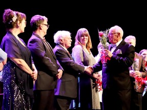 Brockville and Area Music and Performing Arts Hall of Fame chairman Bruce Wylie congratulates inductees or their relatives at the end of the Hall of Fame gala on Thursday night, Mar. 23. 2023 at the Brockville Arts Centre. (RONALD ZAJAC/The Recorder and Times)