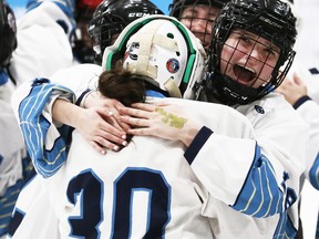 Ursuline Lancers' Ella DeMaeyer celebrates with winning goalie Amber Parent (30) after beating the Chatham-Kent Golden Hawks during a shootout in the LKSSAA girls' hockey AAA final at Chatham Memorial Arena in Chatham, Ont., on Tuesday, Feb. 28, 2023. (Mark Malone/Chatham Daily News)