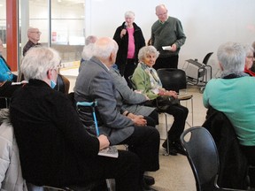 Elaine MacDonald speaks with Brian Lynch during the local organizing meeting for a referendum in opposition to the provincial government's Bill 60 at the Benson Centre on Sunday March 19, 2023 in Cornwall, Ont. Greg Peerenboom/Special to the Cornwall Standard-Freeholder/Postmedia Network
