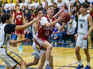Cobras Brayden Chamberlin lunges in for a layup against the Bobcats at Bow Valley High School in Cochrane on Thursday, March 2, 2023. The Bobcats beat the Cobras 76-69 in the RVSA play-off semifinal.