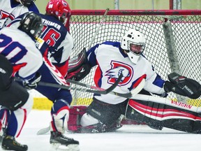 Devon Bison goalie Cassen Van Slyke (31) flashes the leather after a shot from forward Dylan Thimer (96) of the Gibbons Broncos. (Gord Mellor -- 20/20 Photographic Inc.)