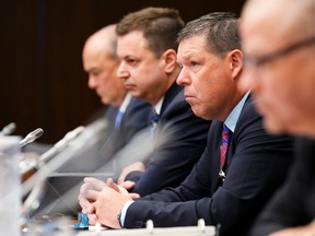 Hockey Canada's then-president Scott Smith, second from right, appears alongside fellow witnesses at a July parliamentary committee hearing into how Hockey Canada handled allegations of sexual assault. The top executive and board of directors of the organization later stepped down.