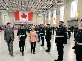 Canada's Prime Minister Justin Trudeau, left, and European Commission President Ursula von der Leyen inspect the ranks of the Princess of Wales' Own Regiment, the Signals branch and 21 Electronic Warfare Regiment at Canadian Forces Base Kingston on Tuesday, March 7.