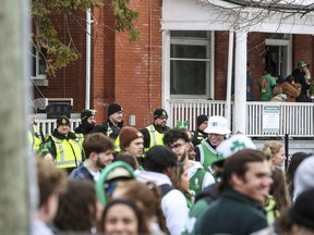 Thousands of students party on Aberdeen Street in Kingston's University District to mark St. Patrick's Day on Saturday, March 18.