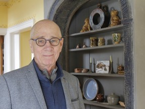 Local author Moe Johnson in front of some of his personal pottery collection in his Bath, Ont., home that is included in his new book, The Potter's Reach In 19th Century Ontario, on Wednesday, March 22, 2023. The book will be available in early April 2023.