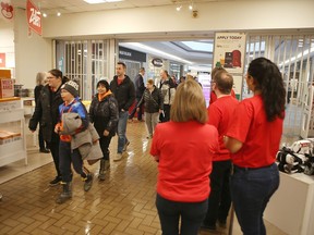 Shoppers file into the new Zellers store that opened in the Cataraqui Centre in Kingston on Thursday.