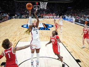 UConn Huskies forward Aaliyah Edwards (3) of Kingston shoots the ball against the Ohio State Buckeyes in their Sweet 16 game at the NCAA women's basketball tournament in Seattle.