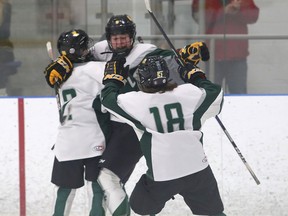 Holy Cross Crusaders' Alexis Brunet, middle, celebrates the winning goal with Quinn McFarlane (18) and Nayia Skourtis in a 2-1 Holy Cross win over the Napanee Hawks In the Kingston Area Secondary Schools Athletic Association girls hockey final at the Invista Centre on Wednesday, March 1, 2023.