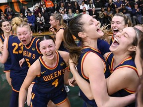 The Queen's Gaels celebrate their 72-62 U Sports women's basketball championship semifinal win over the Alberta Pandas in Halifax on Saturday, March 11, 2023.