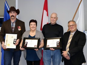 At a ceremony in Mayerthorpe recently, (l-r) Adam Naslund, Janet Jabush and Jeff Lowe each received a Platinum Jubilee Medal and commemorative coin from Yellowhead MP Gerald Soroka. The Queen Elizabeth II Platinum Jubilee Medal honours recipients for “outstanding service” and was created to mark the late monarch’s 70th year on the throne. The honourees spoke about their service and what the occasion meant to them.