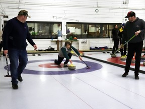 Kelli Mitchell launched a rock, flanked by teammates Kelli, left, and Scott Olsen. They were one of the Mayerthorpe teams in the mixed bonspiel, hosted by the Mayerthorpe Curling Club this weekend. Thirteen teams participated overall.