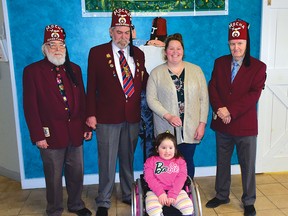 Photo by KEVIN McSHEFFREY
Mocha Huron Shrine Cub members Jim Gibbs – secretary, Dan Berry – president, and Gordon McCarthy were with four-year-old Malia Latendresse and her mother Alexcie. The Shriners helped send Malia to the Shriners Hospital for Children in Montreal for treatment for several birth defects that afflicted the young girl.