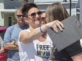 Sophie Smith-Doré receives a hug from a supporter before the raising of Arnprior's first ever Pride flag in front of its town hall for Pride Week in 2019. Smith-Doré led the charge alongside Pflag to get the town council to vote in favour of the flag. She is the mom of a transgender student at St. Joseph's Catholic High School in Renfrew. Errol McGihon
