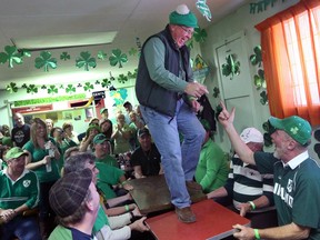 Back in 2013, John O'Neil takes a dance on a table at the Douglas Tavern located in the village of Douglas ,Ont. during St. Patrick's Day celebrations. Bruno Schlumberger