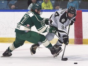 Austin Keleher, left, of the St. Marys Lincolns and Jake Eaton of the LaSalle Vipers battle for the puck on during a playoff game last spring.