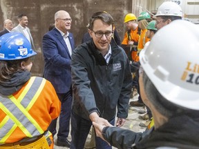 Monte McNaughton, Ontario's labour minister, greets students at the LIUNA training centre on Wilton Grove Road in London Wednesday before announcing new workplace washroom mandates, including female-only washrooms on job sites. McNaughton was flanked by Elgin--Middlesex--London MPP Rob Flack
(Mike Hensen/Postmedia Network)