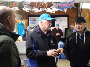 Ron Allison, middle, a Bluewater Anglers operator, explains how their new heating and ventilation system, paid for through an Ontario Trillium Foundation grant, works during an open house Saturday.  Terry Bridge/Sarnia Observer/Postmedia Network