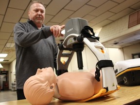 Kenneth Stubbs with Stryker demonstrates a LUCAS Chest Compression Machine at the Legion hall in Petrolia March 24. A Project Thumper campaign via the CEEH Auxiliary is raising $20,000 to purchase one for Charlotte Eleanor Englehart Hospital. (Tyler Kula/ The Observer)