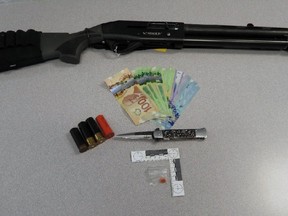 Lambton OPP issued this photo of a sawed-off shotgun they seized following a drug raid of a home in Walpole Island on Dec. 17, 2021. (Lambton OPP)